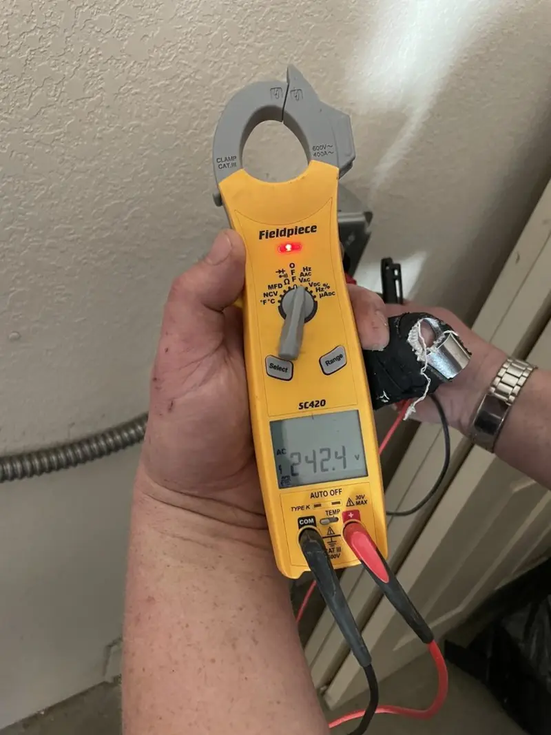 Voltage testing with clamp meter during Electrical Installation Services in Lewiston